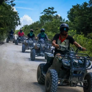 Group enjoying an off-road ATV tour through tropical trails in Cozumel Mexico