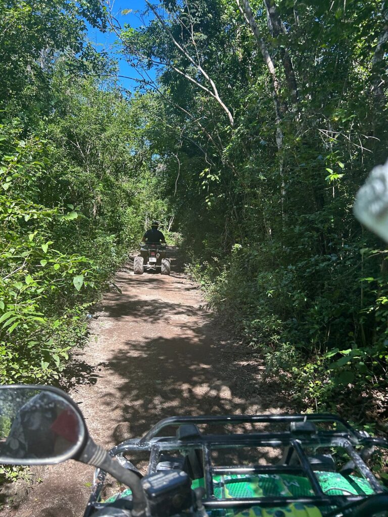 ATV riding through tropical jungle trails during a Cozumel ATV excursion in Mexico