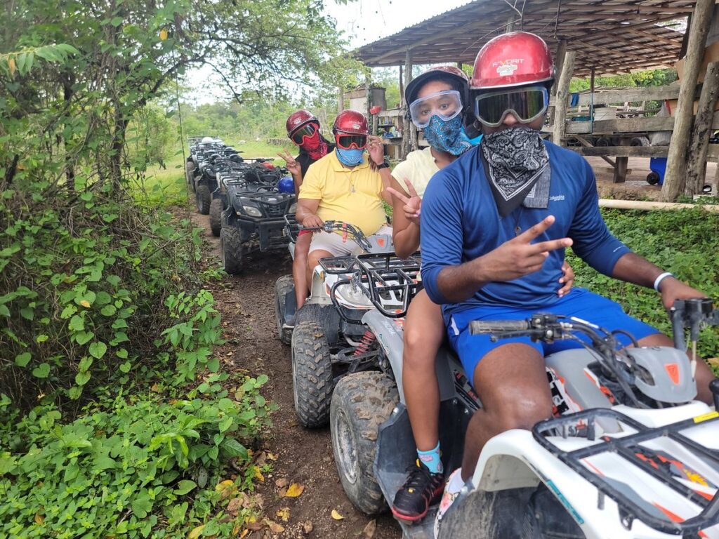 Group enjoying a guided ATV tour in Cozumel Mexico through jungle trails